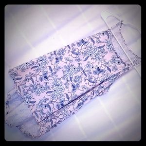 Pink tank top. High neck, long back.